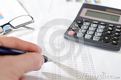 Businesswoman checking financial documents