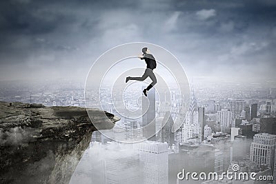 Businesswoman jumping against city background