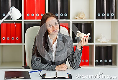 Businesswoman with a model of plane.