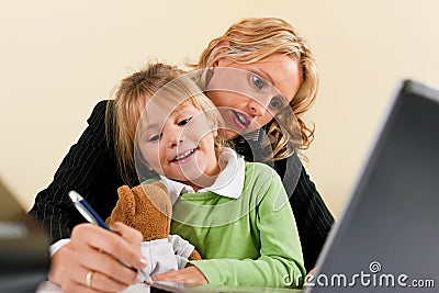 Businesswoman and mother is working at home