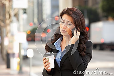 Businesswoman Outside Office On Mobile Phone