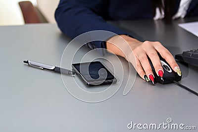 Businesswoman s hand on mouse