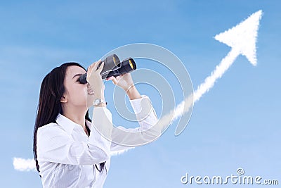 Businesswoman see success cloud with binoculars