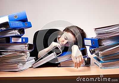 Businesswoman sleeping at office