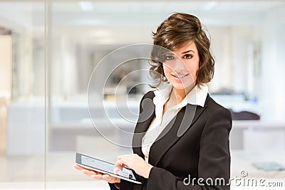 Businesswoman with tablet computer in the office