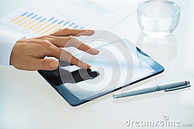 Businesswoman with tablet pc in office