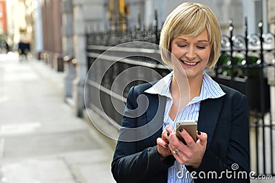 Businesswoman using her smart phone