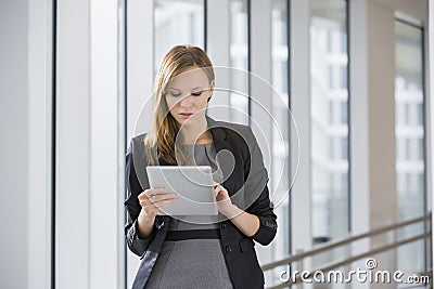 Businesswoman using tablet PC in office