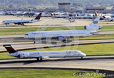 Busy airport scene with multiple planes