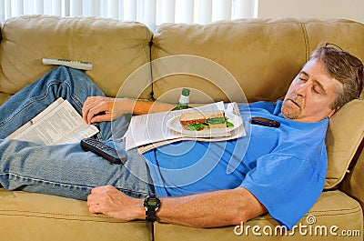 Busy sleeping man couch potato