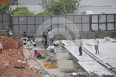 The busy workers on the construction site in shenzhen