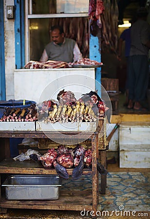 Butcher and his stall at the market in India