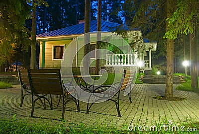 Cabin in the night forest