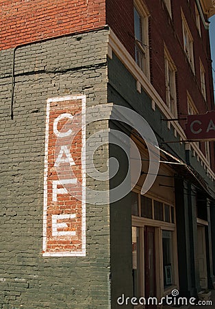 Cafe sign on historic brick building