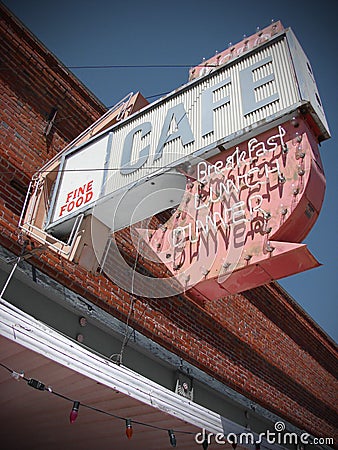 Cafe sign on old abandoned building