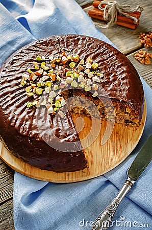 Cake with nuts, chocolate chips and chocolate glaze