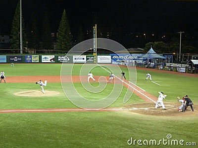 Cal State Northridge pitcher throws ball to UH Baseball players