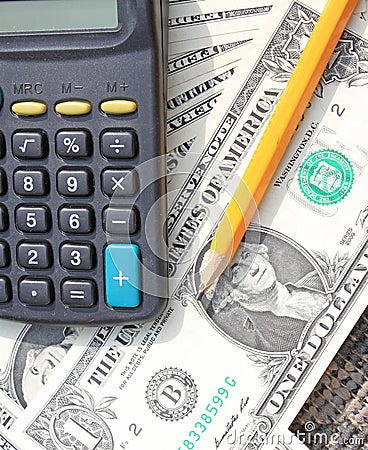 Calculator, pen and pad at dollars