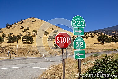 California Road Signs at Crossroad
