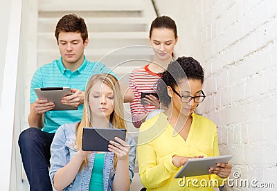 Calm students with tablet pc computer