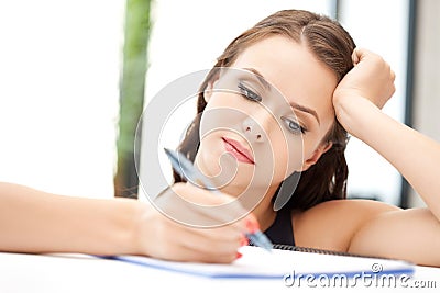 Calm woman with big notepad