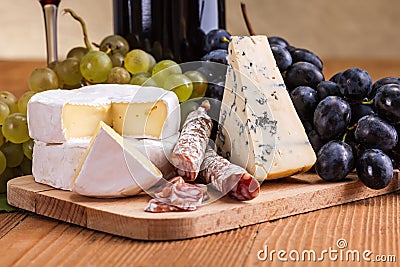 Camembert, blue cheese and dry sausage snack