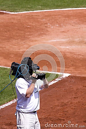 Cameraman on Baseball Field