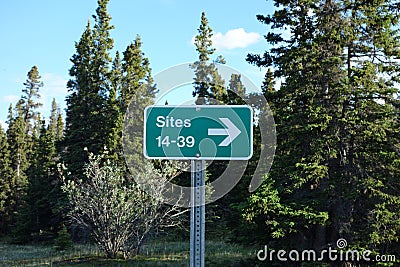 A campsite directional sign.