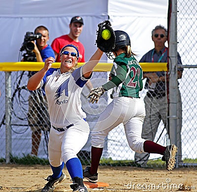 Canada games softball women catch ball runner