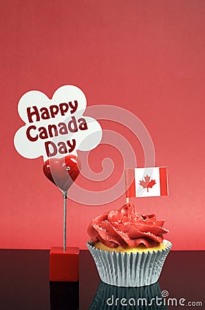 Canadian cupcake with maple leaf flag and Happy Canada Day sign