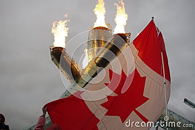 Canadian flag with Olympic flame and rain