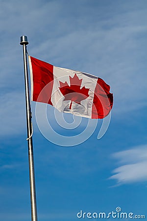 Canadian flag waving in the wind.