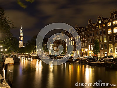 Canal With Westerkerk In Amsterdam At Night