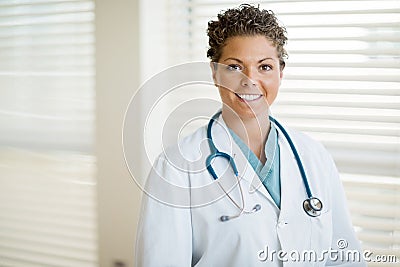 Cancer Specialist In Labcoat Standing At Clinic
