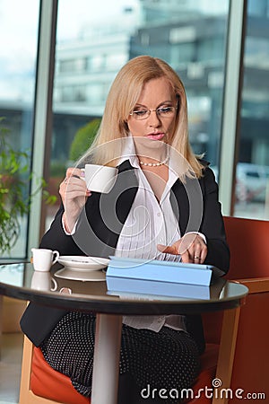 Candid photo of a middle-aged blond businesswoman