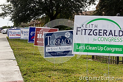 Candidate signs outside polling place during presidential election