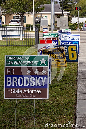 Candidate signs outside polling place during presidential election