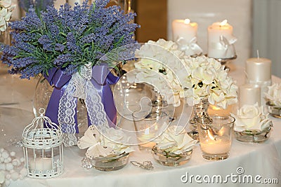 Candles, hydrangeas and white roses