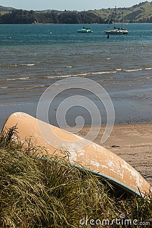 Canoe turned upside down on seashore