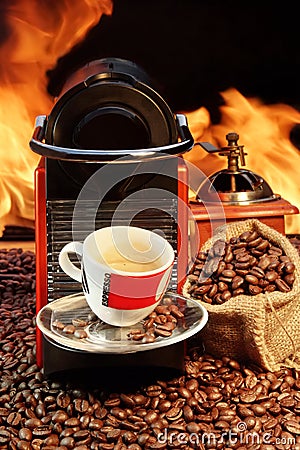Capsule Coffee machine with espresso cup near fireplace