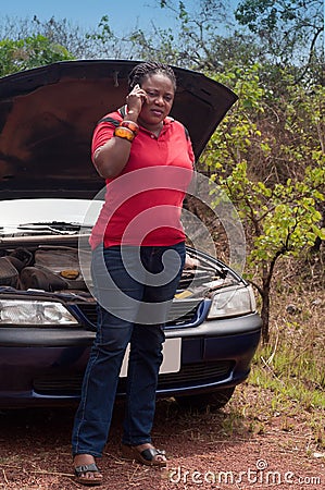 Car breakdown - African American woman call for help, road assistance.