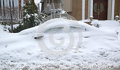 Car completely under snow after massive winter storms strikes Northeast