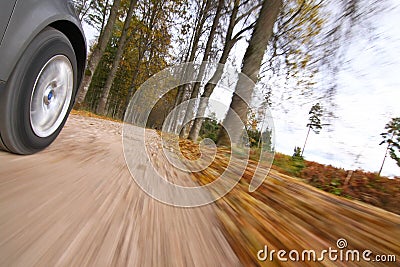 Car driving on country road.