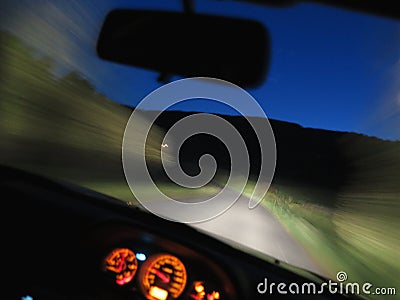 Car driving fast at night