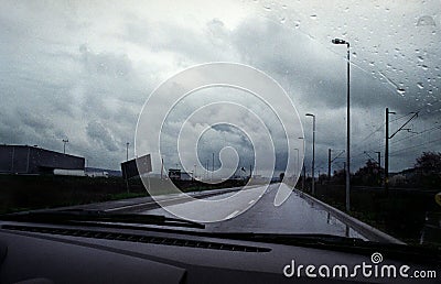 Car driving through storm