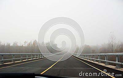Car in a fog road