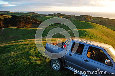 Car at green hill top rural area