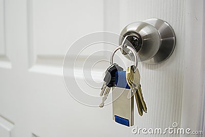 Keys hanging from a house doorknob