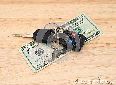 Car keys atop money