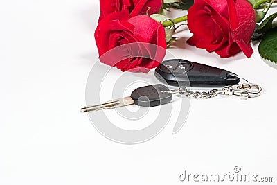 Car keys and roses bouquet present